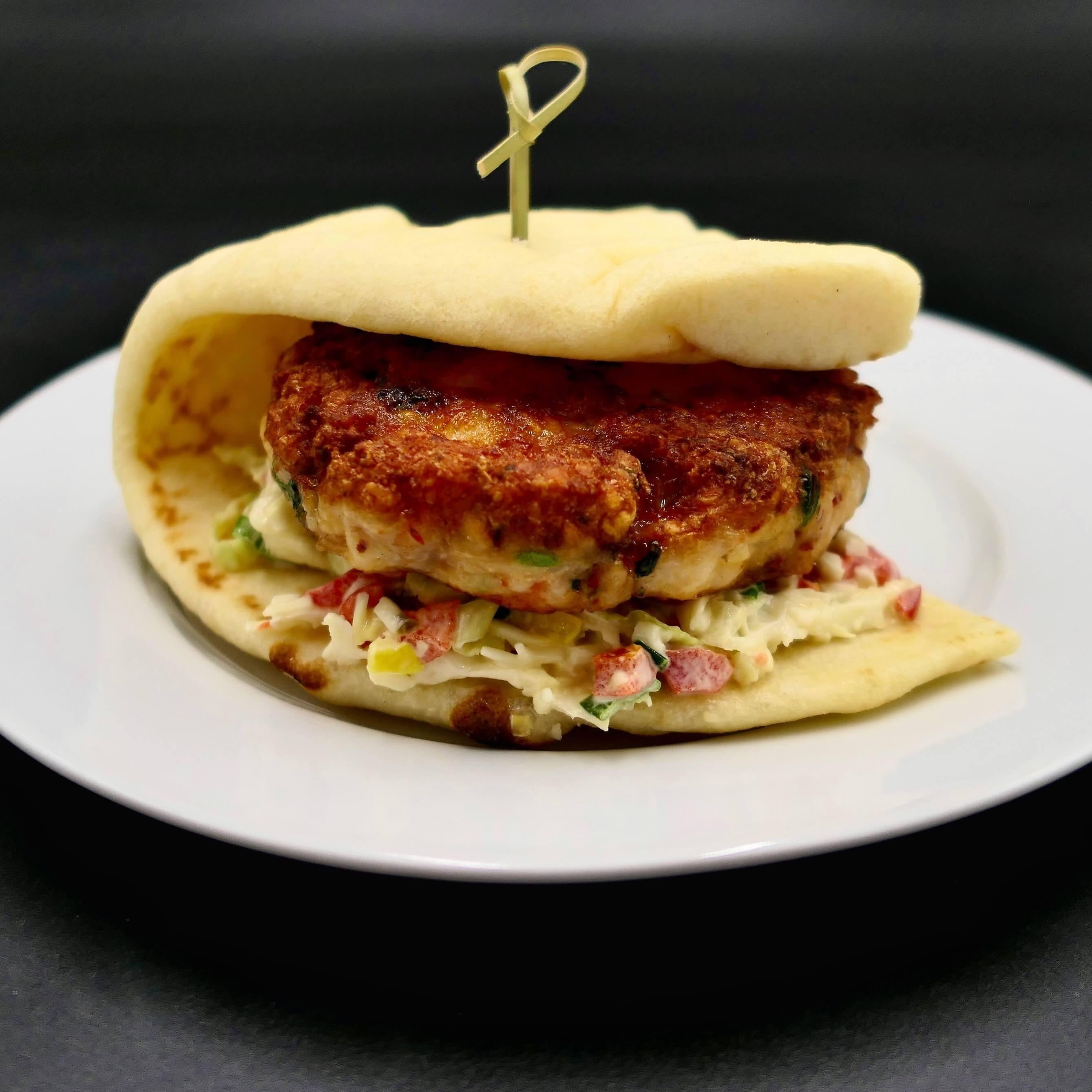 http://www.northcoastseafoods.com/cdn/shop/products/Caliente-Shrimp-Burger-on-Pita-square-crop.jpg?v=1686767256